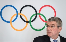 (FILES) In this file photo taken on January 10, 2020 International Olympic Committee (IOC) President Thomas Bach attends a press conference in Lausanne. (Photo by Fabrice COFFRINI / AFP)