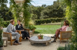 This undated image released March 7, 2021 courtesy of Harpo Productions shows Britain's Prince Harry (L) and his wife Meghan (C), Duchess of Sussex, in a conversation with US television host Oprah Winfrey. Britain's royal family on March 7, 2021 braced for further revelations from Prince Harry and his American wife, Meghan, as a week of transatlantic claim and counter-claim reaches a climax with the broadcast of their interview with Oprah Winfrey. The two-hour interview with the US TV queen is the biggest royal tell-all since Harry's mother princess Diana detailed her crumbling marriage to his father Prince Charles in 1995.
Joe PUGLIESE / HARPO PRODUCTIONS / AFP