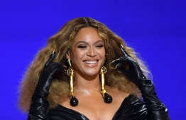 In this handout photo courtesy of The Recording Academy, Beyonce accepts the Best Rap Performance award for "Savage" onstage during the 63rd Annual GRAMMY Awards at Los Angeles Convention Center on March 14, 2021 in Los Angeles, California. (Photo by Kevin Winter / The Recording Academy / AFP) / 
