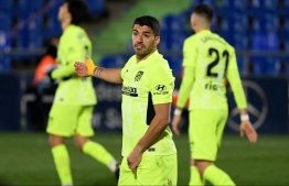 Atletico Madrid's Uruguayan forward Luis Suarez gestures during the Spanish League football match between Getafe and Atletico Madrid at the Coliseum Alfonso Perez stadium in Getafe, south of Madrid, on March 13, 2021. (Photo by PIERRE-PHILIPPE MARCOU / AFP)
