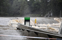 Flood water flow through the Parramatta wharf during the heavy rain in Sydney on March 20, 2021, amid mass evacuations being ordered in low-lying areas along Australia's east coast as torrential rains caused potentially "life-threatening" floods across a region already soaked by an unusually wet summer.
Saeed KHAN / AFP