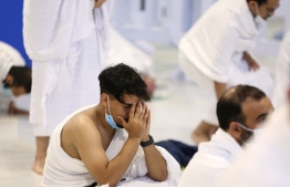 A man praying: People who had gone to Umrah with Mash'ar Tours stranded in Mecca.