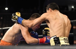 Filipino boxer Nonito Donaire (L) punches French boxer Nordine Oubaali (R) during the Bantamweight World Championship boxing match at Dignity Health Sports Park on May 29, 2021 in Carson, California. (Photo by Patrick T. FALLON / AFP)