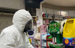 A cleanTech worker deep cleaning inside a shop -- Photo: CleanTech