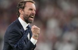 އިންގްލެންޑުގެ ކޯޗު ގެރެތު ސައުތުގޭޓް ޕޮލްކާ ޑޮޓް ޖެހި ލަކީ ޓައި އަޅާފާ. --ފޮޓޯ:އޭއެފްޕީ