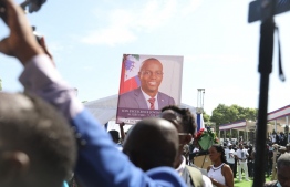 Mourners attend the funeral of slain Haitian President Jovenel Moïse on July 23, 2021, in Cap-Haitien, Haiti, the main city in his native northern region. Moïse, 53, was shot dead in his home in the early hours of July 7 Photo: Valerie Baeriswyl/ AFP