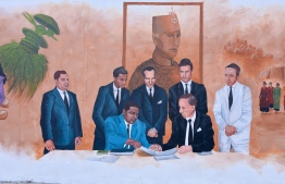 A wall mural depicting the agreement signing between the Maldives and British that led to the island nation achieving independence--