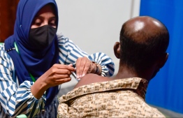 (FILE) A health worker administering the AstraZeneca vaccine: the vaccination program aimed at children are organised by HPA, Education Ministry, and Health Ministry -- Photo: Nishan Ali