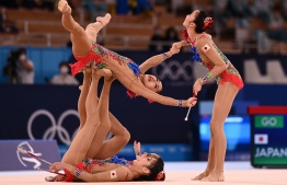 Team Japan competes in the group all-around final of the Rhythmic Gymnastics event during Tokyo 2020 Olympic Games at Ariake Gymnastics centre in Tokyo, on August 8, 2021 -- Photo: Martin Bureau/ AFP