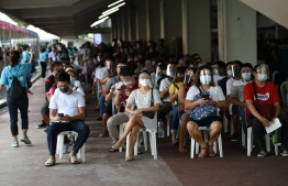 Residents queue for vaccination in Marikina City, suburban Manila on August 6, 2021, as authorities imposed another lockdown to slow the spread of the hyper-contagious Delta variant and ease pressure on hospitals while trying to avoid crushing economic activity -- Photo: Ted Aljibe/ AFP
