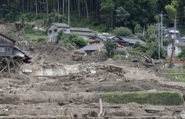 This picture shows the site of a landslide caused by heavy rain in Kanzaki City, Saga Prefecture on August 15, 2021 -- Photo by STR / JIJI PRESS / AFP
