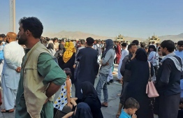 Afghans crowd at the tarmac of the Kabul airport on August 16, 2021, to flee the country as the Taliban were in control of Afghanistan after President Ashraf Ghani fled the country and conceded the insurgents had won the 20-year war -- Photo: AFP