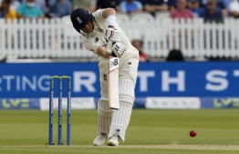 England's captain Joe Root plays a shot on the third day of the second cricket Test match  between England and India at Lord's cricket ground in London on August 14, 2021 -- Photo by Ian Kington/ AFP