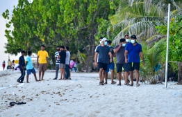 (FILE) Indian tourists walking along the beach in Hulhumale' on August 18, 2021: over 80,000 tourists have arrived to Maldives from India in 2022 -- Photo: Ahmed Awshan Ilyas / Mihaaru