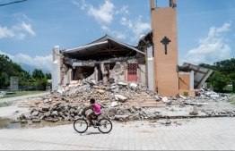 The Church St Anne is seen completely destroyed by the earthquake in Chardonnieres, Haiti on August 18, 2021 - More than 9,900 people were wounded when the quake struck the southwestern part of the Caribbean nation on Saturday, about 100 miles (160 kilometers) to the west of the capital Port-au-Prince, according to the updated toll -- Photo: Reginald Louissaint Jr/ AFP