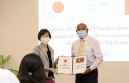 Japanese Ambassador to Maldives Keiko Yanai (L) hands over the AstraZeneca vaccines to Health Minister Ahmed Naseem in a ceremony held in the Foreign Ministry in Sunday -- Photo: Foreign Ministry