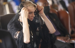 (FILES) In this file photo taken on March 18, 2021 Princess Charlene of Monaco (L) reacts during the memorial service of King Goodwill Zwelithini at the KwaKhethomthandayo royal palace in Nongoma, South Africa. - Princess Charlene of Monaco was in stable condition on September 3, 2021 after being hospitalised in South Africa, her foundation said. -- Photo: Phill Magakoe / POOL / AFP
