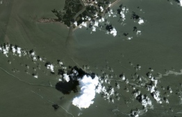 This handout satellite image released by Maxar Technologies and taken by Copernicus Sentinel-2, on September 5, 2021, shows oil slicks from spills in Gulf of Mexico off the coast of Louisiana. - Workers have deployed containment booms and skimmer devices as they attempt to contain a sizable oil spill in the Gulf of Mexico discovered after Hurricane Ida roared through the area, the US Coast Guard said on September 5, 2021. -- Photo: Copernicus Sentinel-2 / AFP