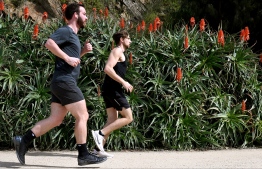 People exercise in Melbourne on September 9, 2021, as Victoria and New South Wales announce an easing of coronavirus restrictions amid the pandemic. -- Photo: William West/ AFP