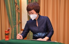 (FILE) Chinese Ambessedor Wang Lixin signs registry of guests at President's Office: Ambassador Wang Lixin said she was satisfied with the bilateral relationship between the two nations -- Photo: President's Office
