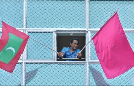 Former President Abdulla Yameen waving flags from his window to supporters -- Photo: Nishan Ali/ Mihaaru