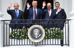 (FILES) In this file photo taken on September 15, 2020, (L-R) Israeli Prime Minister Benjamin Netanyahu, US President Donald Trump, Bahrain Foreign Minister Abdullatif al-Zayani, and UAE Foreign Minister Abdullah bin Zayed Al-Nahyan wave from the Truman Balcony at the White House after they participated in the signing of the Abraham Accords where the countries of Bahrain and the United Arab Emirates recognize Israel, in Washington, DC. - One year ago, the UAE became the first Gulf nation to establish formal relations with the Jewish state, and the third Arab country ever to do so after Egypt and Jordan in 1979 and 1994 respectively. Photo: Saul Loeb /AFP