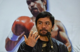 (FILES) This file photo taken on January 24, 2019 shows Philippine boxing icon Manny Pacquiao during a press conference shortly after arriving at the international airport in Manila, days after defeating US boxer Adrien Broner in Las Vegas. - Philippine boxer-turned-politician Manny Pacquiao declared on September 19, 2021 he will run for president in 2022, ending months of speculation about whether the legendary fighter would seek the country's top job. -- Photo: Ted Aljibe/ AFP