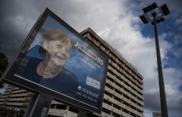 An ad for German online job board StepStone features a portrait of German Chancellor Angela Merkel and reads: "Mother of the Nation, Thank you for 16 years of hard work" in Berlin on September 22, 2021, ahead of parliamentary elections on September 26. -- Photo by John MacDougall / AFP