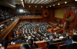 Japanese lawmakers attend a parliament session to elect the new prime minister of Japan at the lower house of parliament in Tokyo on October 4, 2021. -- Photo: Kazuhiro Nogi/ AFP