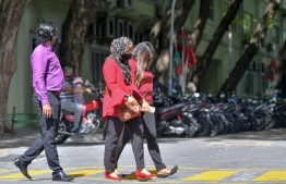 (FILE) Civil Service workers on their way to work on October 4., 2021: Forty six percent of Maldivian women are unemployed -- Photo: Nishan Ali