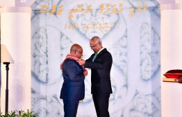 President Ibrahim Mohamed Solih (R) awarding  76th President of United Nation's General Assembly Abdulla Shahid the Nishan Izzudheen Izzath  -- Photo: President's Office