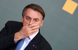 (FILE) Brazilian President Jair Bolsonaro at the Planalto Palace in Brasilia, on October 7, 2021: ICC accused him of "crimes against humanity" on September 12 for his alleged role in the destruction of Amazon -- Photo Evaristo Sa / AFP