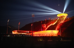 (FILES) This file photo taken on July 14, 2021 shows a light show display at the National Ski Jumping Centre for the Beijing 2022 Winter Olympic Games in Zhangjiakou in northern China's Hebei province. Photo: Noel Celis / AFP