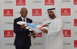 Emirates hands President Ibrahim Mohamed Solih a model airplane after the three party agreement was signed on Tuesday -- Photo: President's Office