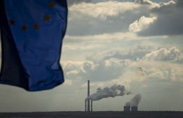 A picture taken on September 30, 2021 shows the European flag in front of the ContourGlobal Maritsa East III Thermal Power Plant near the village of Mednikarovo. --  Photo: Nikolay Doychinov/ AFP