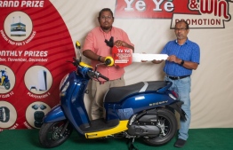 BHM giving the luckydraw winners a ceremonial key to their new Scoopy motorcycle -- Photo: BHM