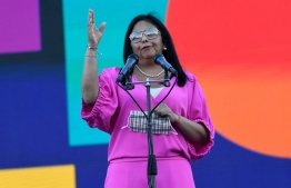 Venezuelan Vice-President Delcy Rodriguez speaks as members of the National System of Orchestras of Venezuela attempt to enter the Guinness Book of Records for the largest orchestra in the world, with more than 12,000 musicians, at the Military Academy of the Bolivarian Army in Fuerte Tiuna Military Complex, in Caracas, on November 13, 2021. (Photo by Federico PARRA / AFP)