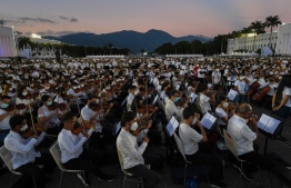 Members of the National System of Orchestras of Venezuela play during an attempt to enter the Guinness Book of Records for the largest orchestra in the world, with more than 12,000 musicians, at the Military Academy of the Bolivarian Army in Fuerte Tiuna Military Complex, in Caracas, on November 13, 2021. (Photo by Federico PARRA / AFP)