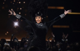 This handout photo courtesy of American Broadcasting Companies, Inc. / ABC shows US rapper Cardi B perform onstage during the 2021 American Music Awards at the Microsoft Theater on November 21, 2021 in Los Angeles. (Photo by American Broadcasting Companies, Inc. / ABC / AFP) / 