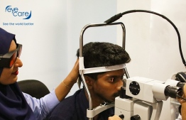 Eye care team examines a patient's eye