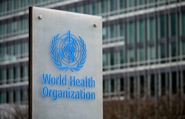 (FILE) This photograph taken on December 2, 2021, shows a sign of the the World Health Organization (WHO) next to theirs headquarters, in Geneva.  -- Photo: Fabrice Coffrini/ AFP