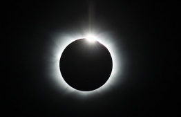 Handout picture released by Imagen Chile showing a total solar eclipse from Union Glacier in Antarctica, on December 4, 2021. -- Photo: Felipe Trueba / Imagen Chile / AFP