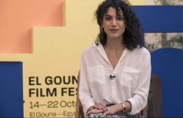 Iraqi actress and director Zahraa Ghandour poses for photo during an interview on the sideline of the 5th edition of the Gouna Film Festival in Egypt's Red Sea resort of el-Gouna, on October 21, 2021. - Alongside celebrities gracing the red carpet at film festivals in Egypt, the traditional powerhouse of regional cinema, young Arab women directors are making their mark with documentaries tackling subjects ranging from femicide to revolution. (Photo by Khaled Desouki / AFP