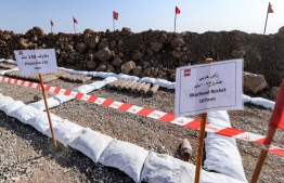 This picture taken on November 29, 2021 shows a view of (L to R) 130mm projectiles and 107mm warheads recovered by the Global Clearance Solutions (GCS) private demining company in an area near the village of Hassan-Jalad, north of Iraq's northern city of Mosul.  -- Photo: Zaid Al-Obeidi / AFP