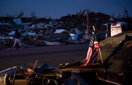 Tornado damage is seen after extreme weather hit the region December 11, 2021, in Mayfield, Kentucky. - Dozens of devastating tornadoes roared through five US states overnight, leaving more than 80 people dead Saturday in what President Joe Biden said was "one of the largest" storm outbreaks in history. -- Photo: Brendan Smialowski / AFP