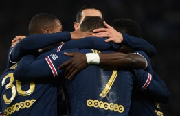 Paris Saint-Germain's French forward Kylian Mbappe (L) celebrates with teammates after scoring a goal during the French L1 football match between Paris Saint-Germain (PSG) and AS Monaco (ASM) at the Parc des Princes stadium in Paris, on December 12, 2021. -- Photo: Franck Fife / AFP