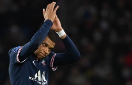 Paris Saint-Germain's French forward Kylian Mbappe applauds as he leaves the pitch during the French L1 football match between Paris Saint-Germain (PSG) and AS Monaco (ASM) at the Parc des Princes stadium in Paris, on December 12, 2021. -- Photo: Franck Fife / AFP