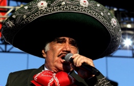 (FILES) In this file photo taken on October 06, 2019 Mexican singer, actor and film producer Vicente Fernandez, known as 'El Rey de la Musica Ranchera' (The King of Ranchera Music), sings during the unveiling of a life-size statue in his honour, at the Mariachis square in Guadalajara, state of Jalisco, Mexico. - Fernandez, the most important representative of ranchera music in Mexico, died on December 12, 2021 in Guadalajara at 81, after remaining in the hospital for almost five months due to a domestic accident, his family informed. -- Photo: Ulises Ruiz / AFP