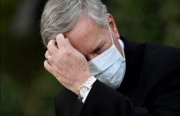 (FILES) In this file photo taken on October 07, 2020, White House Chief of Staff Mark Meadows wears a facemask as he walks back to the West Wing following an interview with FOX News outside the White House in Washington, DC. - US lawmakers are set to vote on December 14, 2021, on a criminal contempt referral against Meadows for refusing to testify before the congressional panel investigating the January 6 assault on the Capitol.-- Photo: Olivier Douliery / AFP