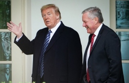(FILES) In this file photo taken on May 08, 2020, US President Donald Trump walks with Chief of Staff Mark Meadows after returning to the White House from an event at the WWII memorial in Washington, DC. - US lawmakers are set to vote on December 14, 2021, on a criminal contempt referral against Meadows for refusing to testify before the congressional panel investigating the January 6 assault on the Capitol.  -- Photo: Mandel Ngan/ AFP